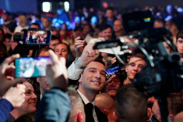 President of the French far-right Natio<em></em>nal Rally (Rassemblement National-RN) party Jordan Bardella takes a selfie with supporters, during a political rally to launch the party's campaign for the European elections, in Marseille, France, March 3, 2024. REUTERS/Go<em></em>nzalo Fuentes