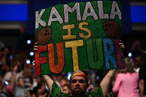 A supporter of Vice President and 2024 Democratic presidential candidate Kamala Harris holds a sign before she speaks at Temple University's Liacouras Center in Philadelphia, Pennsylvania.