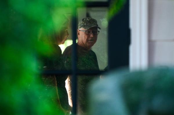 Democratic vice presidential nominee Minnesota Governor Tim Walz prepares to depart from his temporary Governors residence for a campaign rally in Philadelphia on August 6, 2024 in St Paul, Minnesota.