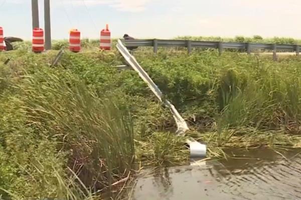 The broken guard rail next tot he canal.