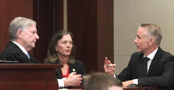 Judge Terence Perkins, Assistant State Attorney Melissa Clark and Defense Attorney Kurt Teifke talk in a sidebar during Brendan Depa's sentencing on Aug. 6, 2024.