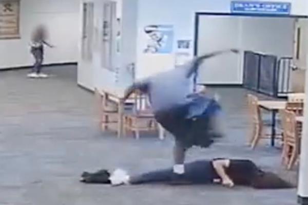 The then 17-year-old, who stands at 6-foot-6, 270-pounds, was seen on security footage sprinting toward the female educator, who turns and spots her assailant a split-second before he shoves her to the floor.