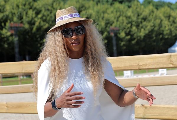 Serena Williams wearing a hat and sunglasses after the Equestrian Jumping Individual Final event at the 2024 Paris Olympics, Chateau de Versailles