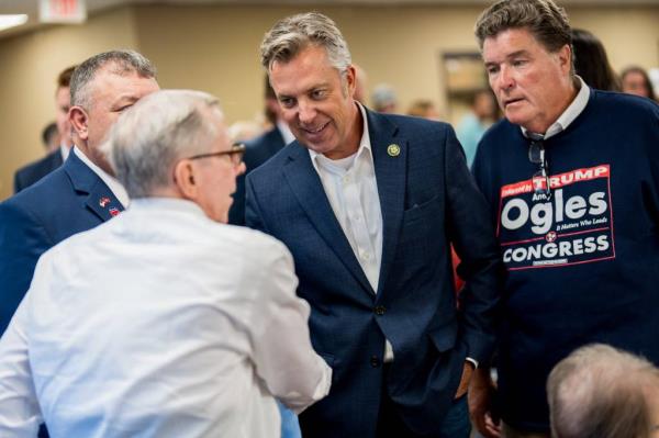 Rep. Andy Ogles, R-Tenn., greets guests during the Marshall County GOP annual dinner at the Lewisburg Recreation Center in Lewisburg, Tenn., Thursday, July 11, 2024.