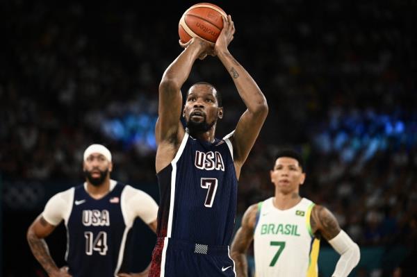 Kevin Durant takes a free throw in the men's quarterfinal basketball match between Brazil and the USA