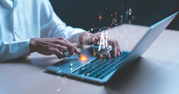 Man using a laptop to interact with artificial intelligence and chatbot technology