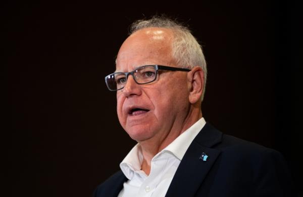 Minnesota Governor Tim Walz speaking at a press co<em></em>nference regarding new gun legislation in Bloomington City Hall, August 2024