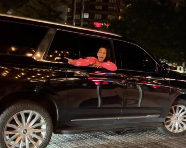 Cardi B is seen leaning from the window of a black SUV shouting "I'm recording you bitch, I'll f*ck you up for real" to a woman involved in a heated debated with others outside a residential building on 605 West 42nd Street in New York City at around 1am on July 29 2024.