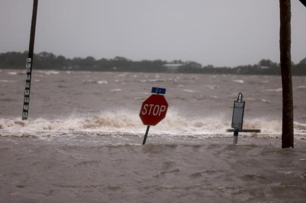 Flood waters reach far up a stop sign in Florida following Hurricane Debby