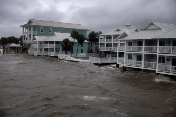 Floor waters reach the ba<em></em>se of a Florida building following Hurricane Debby