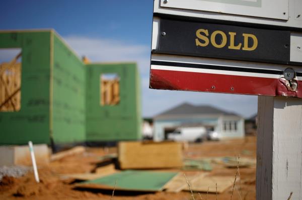 A "Sold" sign at a house under co<em></em>nstruction in Louisville.