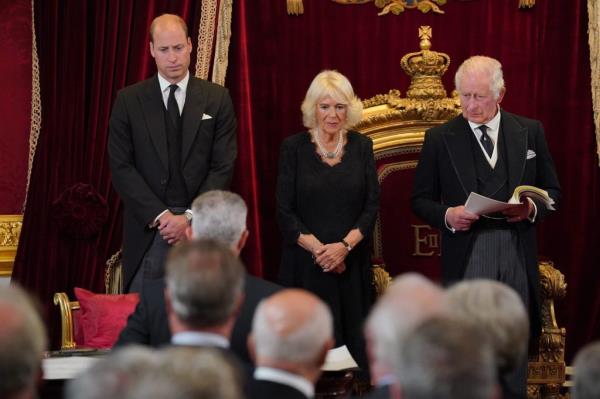 King Charles III at his proclamation ceremony attended by Prince William and Camilla, with crowd in background