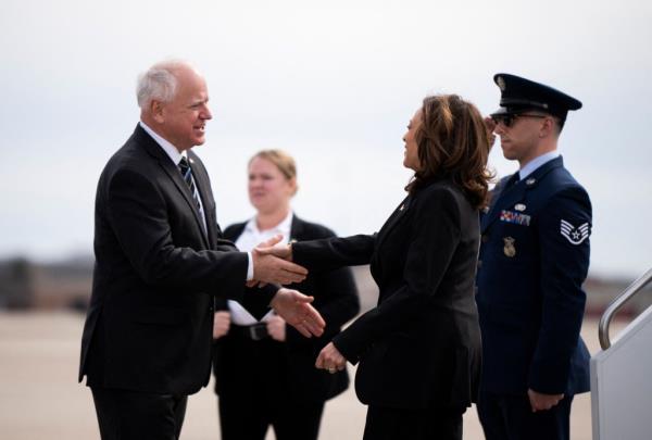 Minnesota Governor Tim Walz greets US Vice President Kamala Harris as she arrives at the Minneapolis-St. Paul Internatio<em></em>nal Airport in Saint Paul, Minnesota, on March 14, 2024.