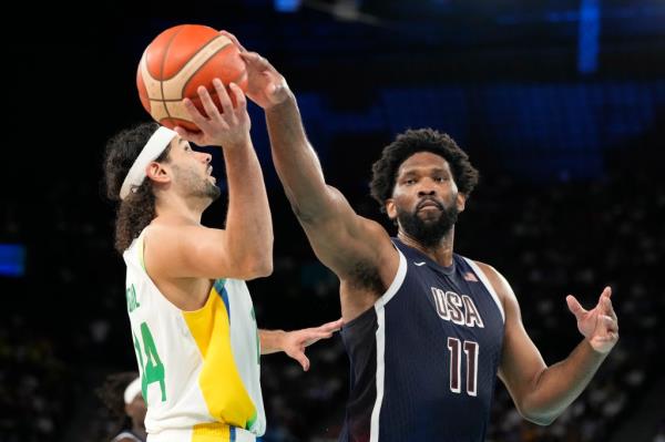 Brazil's Leo Meindl, left, has his shot blocked by United States' Joel Embiid.