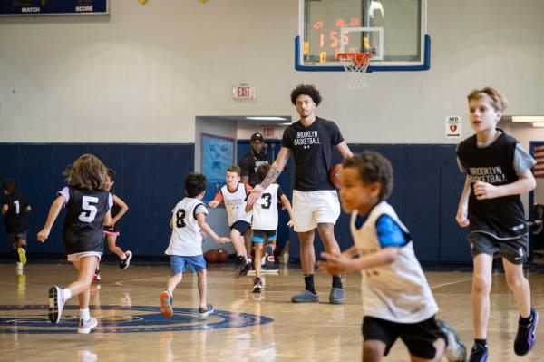 Bklyn Nets Jalen Wilson surprise youth at Bkyn basketball camps.