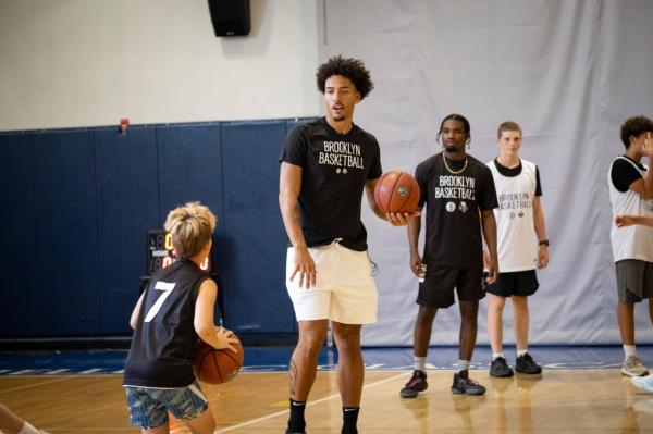 The Nets' Jalen Wilson joined in at summer camp.