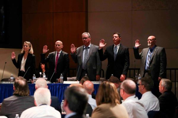 Witnesses are sworn in during a Natio<em></em>nal Transportation Safety Board hearing.