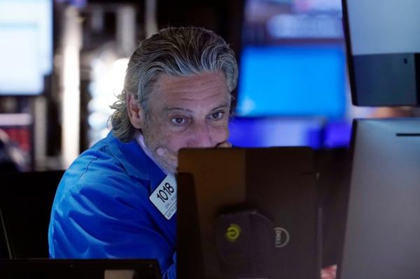 A trader on the floor of the New York Stock Exchange is seen on Friday. Stocks took a severe downturn on Monday.