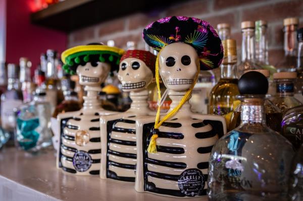 Bottles of tequila shaped like skeletons