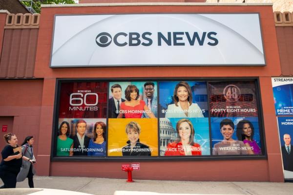 People walking by the CBS Broadcast Center on 57th Street in New York on April 20, 2023.