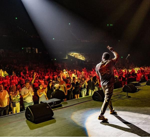 Kevin Hart performing comedy on stage