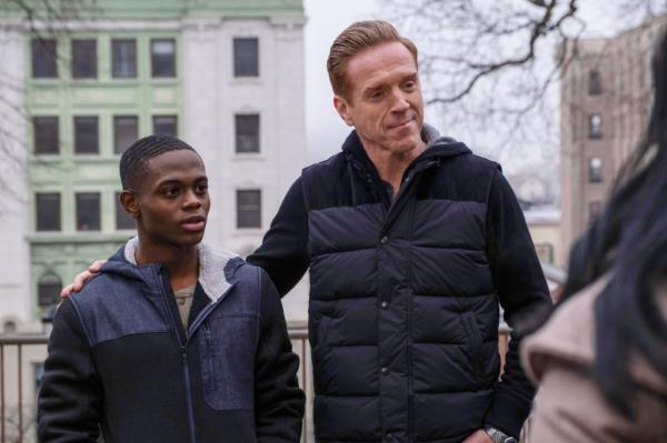 Akili McDowell with Damian Lewis in "Billions" both smiling. 