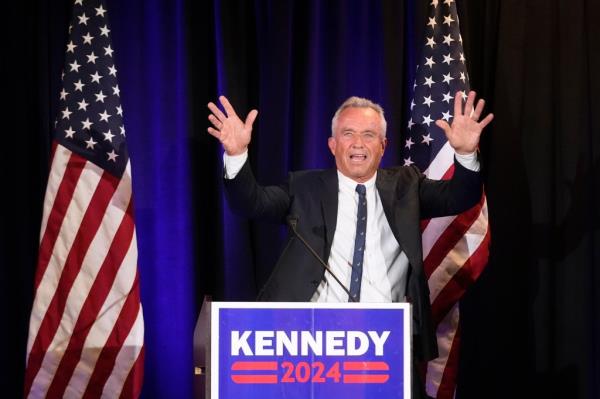 RFK Jr. at a podium with Kennedy 2024 sign.