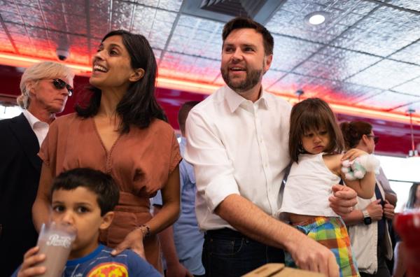 Republican vice presidential nominee U.S. Sen. J.D. Vance (R-OH) carries his daughter Maribel Vance as he and his family greet supporters at the Park Diner on July 28, 2024 in St Cloud, Minnesota.