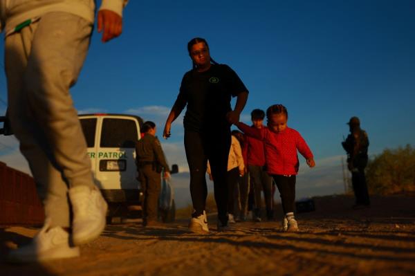 Migrants are taken into Border Patrol custody at the southern border in Sunland Park, New Mexico.