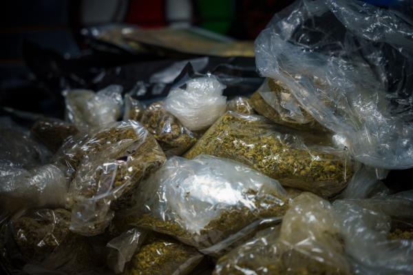 Piles of cannabis wrapped in plastic.