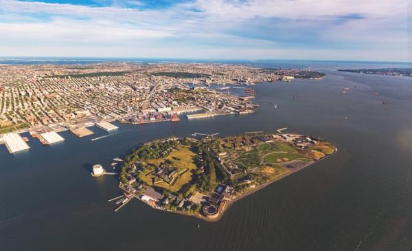 Aerial view of the Governors Island with Brooklyn New York in the background.