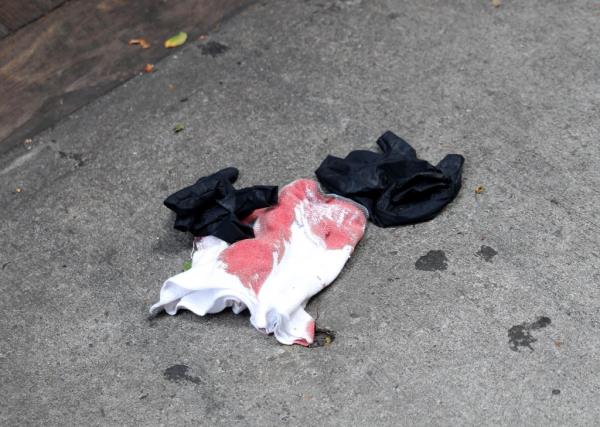 A bloody napkin on the ground at the scene of the stabbing at Dolly Varden.