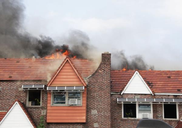 Flames ripping through houses on Francis Lewis Blvd. in Queens Village.