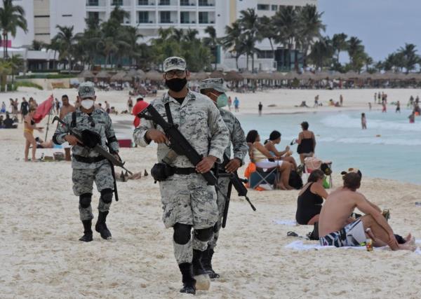 Members of the Natio<em></em>nal Guard on a resort bach.