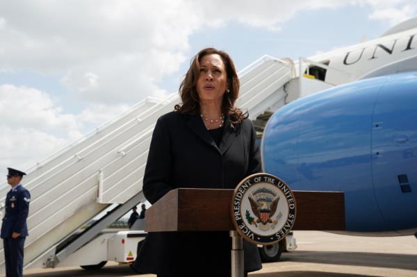 U.S. Vice President Kamala Harris speaking at a podium a<em></em>bout detained individuals' release at George Bush Interco<em></em>ntinental Airport in Houston, Texas.