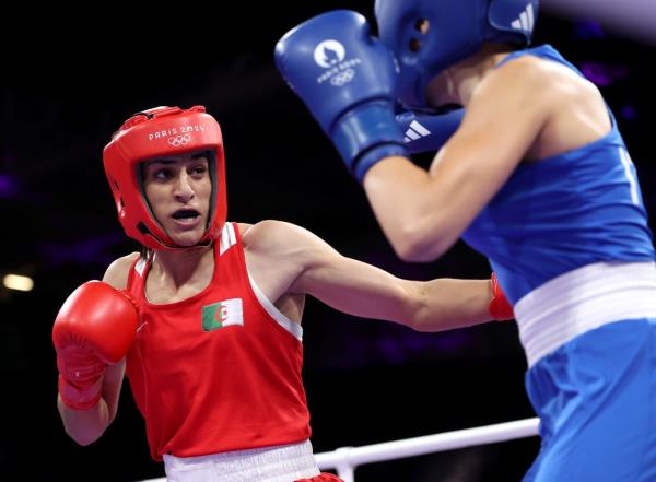 Imane Khelif of Team Algeria landing a punch on Angela Carini of Team Italy during a preliminary 66kg boxing match at the 2024 Paris Olympic Games