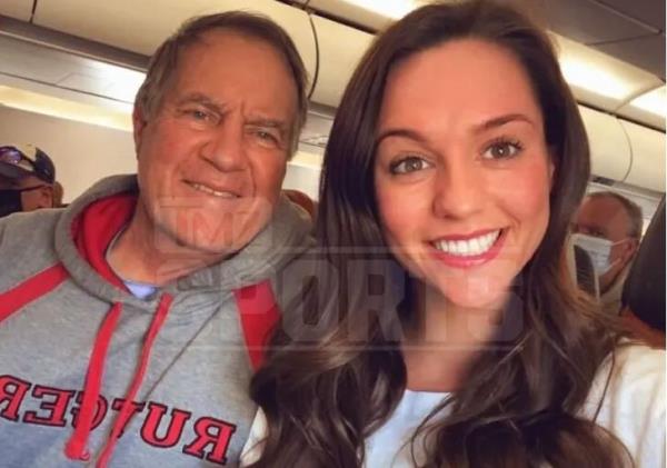 Bill Belichick and Jordon Hudson take a selfie while seated on a flight