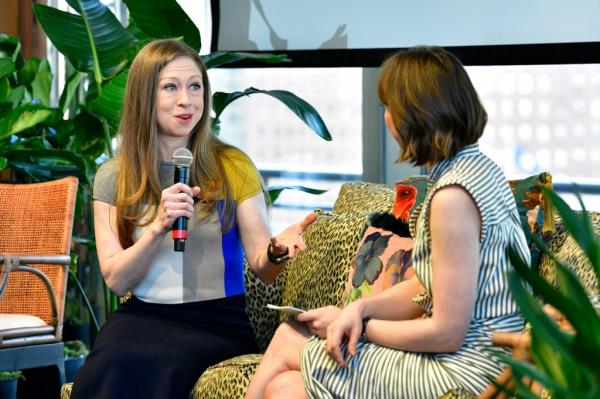 Chelsea Clinton holding a microphone and speaking with Jessica Giles on stage at the 2024 Hearst Eco-Co<em></em>nscious Living Summit in New York City