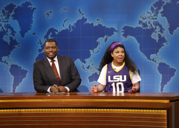 Michael Che and Punkie Johnson sitting at the Weekend Update desk on Saturday Night Live, April 8, 2023