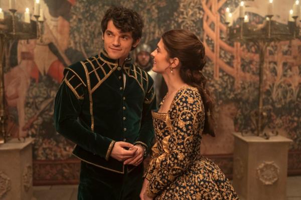 Edward Bluemel standing next to Emily Bader, smiling. 