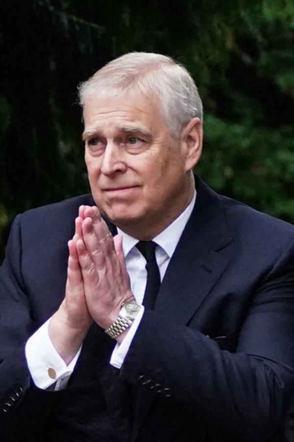 Prince Andrew, Duke of York, in a suit, reacting to the public outside Balmoral Castle after Queen Elizabeth II's death