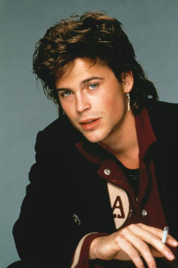 Rob Lowe in 1985 smiling. 