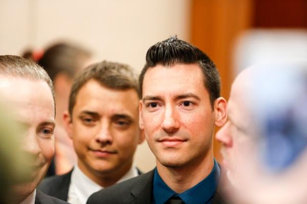 David Daleiden, pro-life activist in suit, arriving at Harris County Courthouse for court appearance over indictment stemming from Planned Parenthood video case