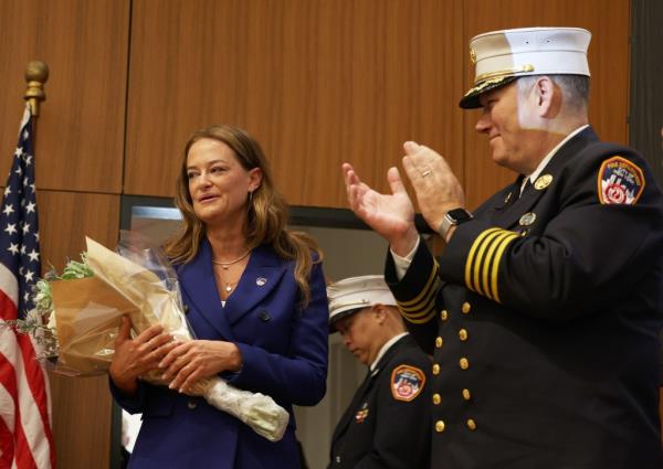 FDNY Commissio<em></em>ner Laura Kavanagh holds flowers.