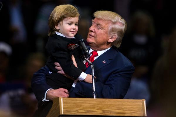 Republican Presidential nominee Do<em></em>nald J. Trump holds two-year-old Hunter Tirpak of Tuscarora, Pa., who is dressed as Trump, during a rally at Mohegan Sun Arena in Wilkes-Barre Twp., Pa. on Monday, Oct. 10, 2016. 