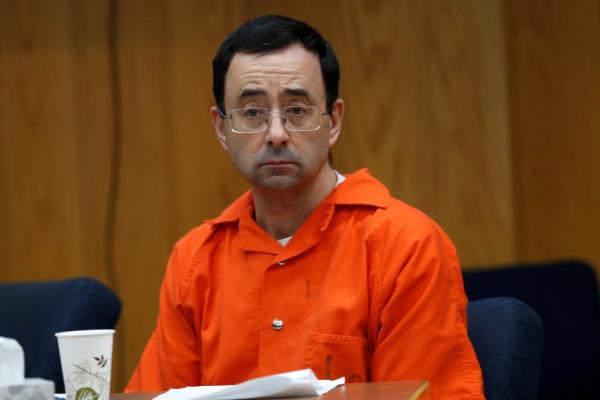 Larry Nassar, a former team USA Gymnastics doctor, in court listening to victims impact statements during his sentencing for sexual assault