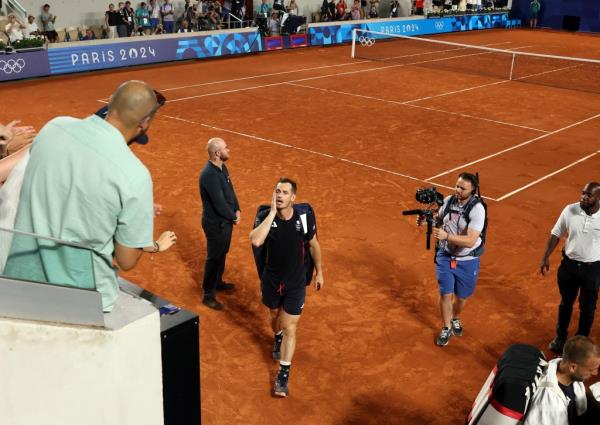 Andy Murray of Team Great Britain reacts with partner (not in f<em></em>rame) Daniel Evans of Team Great Britain as they leave the court after losing match point against Taylor Fritz of Team United States and Tommy Paul of Team United States during the Men's Doubles Quarter-final match on day six of the Olympic Games Paris 2024 at Roland Garros on August 01, 2024 in Paris, France.