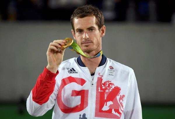 2016 Rio Olympics - Tennis - Victory Ceremony - Men's Singles Victory Ceremony - Olympic Tennis Centre - Rio de Janeiro, Brazil - 14/08/2016. Gold medalist Andy Murray (GBR) of Britain reacts after receiving his medal.