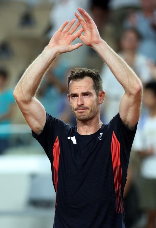 Andy Murray of Team Great Britain acknowledges the crowd with partner (not in f<em></em>rame) Daniel Evans of Team Great Britain after losing match point against Taylor Fritz of Team United States and Tommy Paul of Team United States during the Men's Doubles Quarter-final match on day six of the Olympic Games Paris 2024 at Roland Garros on August 01, 2024 in Paris, France.