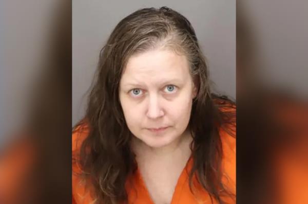 Lauren Riley, a 41-year-old woman in an orange shirt, who was arrested and found in possession of several drugs stored in a pouch labeled 'Bag of Drugs'.